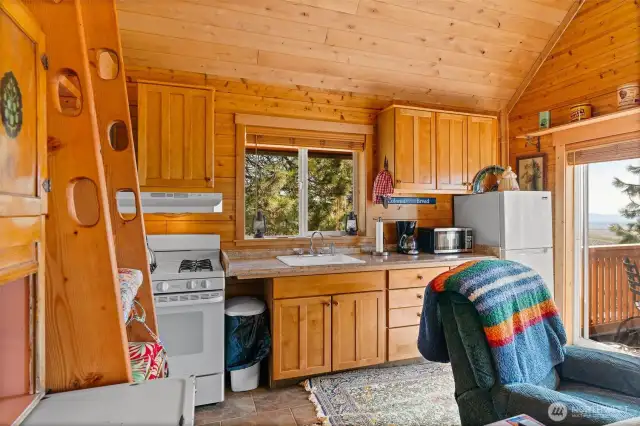 Kitchen is compact yet fully equipped with all the essentials.