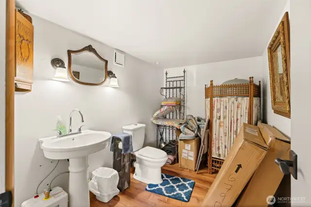 Convenient half bath in the basement suite.