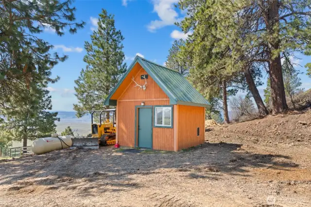 Shed and propane tank.