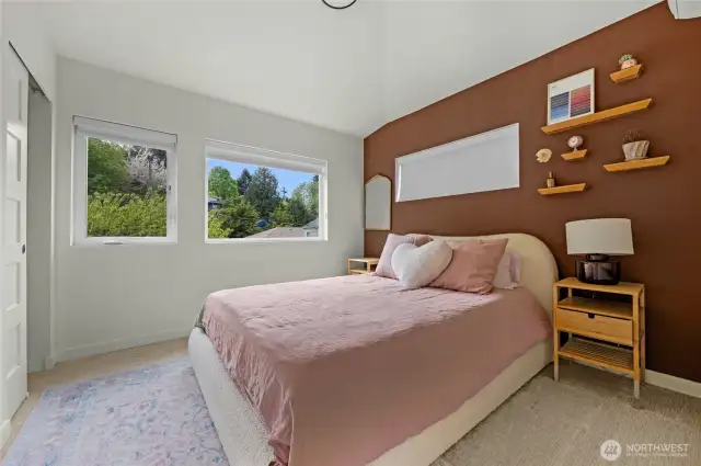 Primary bedroom with lots of natural light. Each bedroom has its own heat and AC.