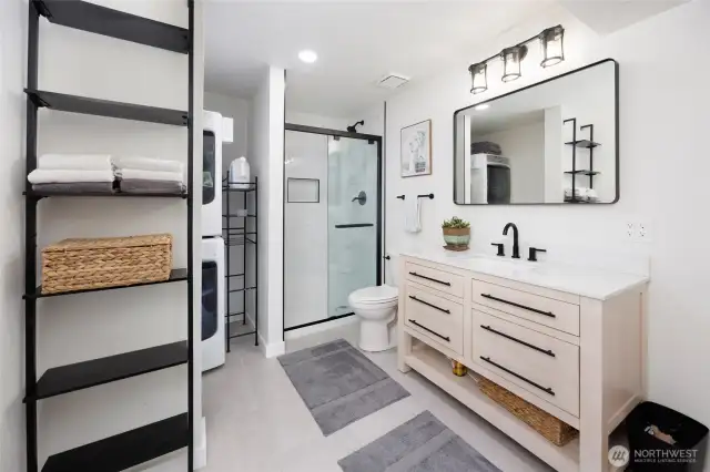 Lower level 3/4 bathroom plus laundry area.