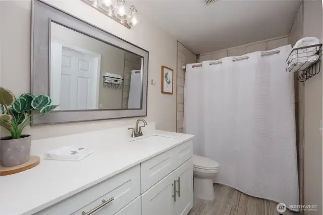 Upper level remodeled full bathroom.