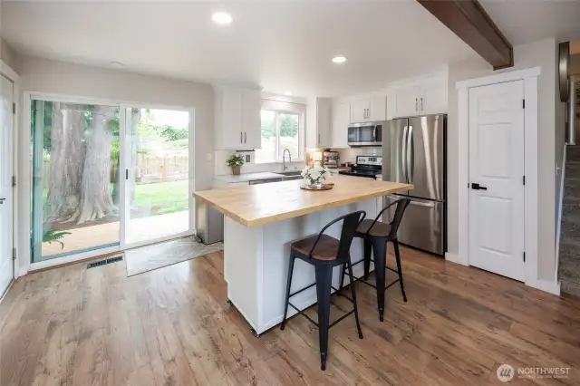 The chef's kitchen has the perfect blend of charm & functionality open to the family room, walk-out deck & ample yard.