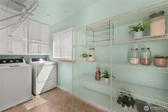 Spacious laundry room/pantry conveniently located off kitchen.