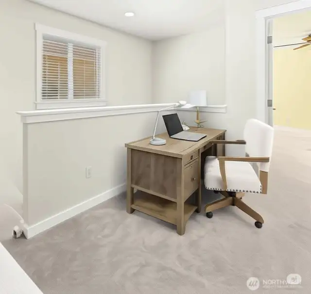 Hallway outside primary bedroom with space for home office!