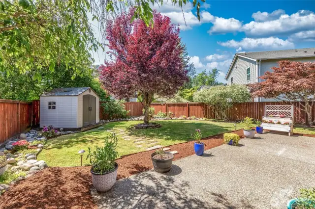 Lovely back yard with storage shed.