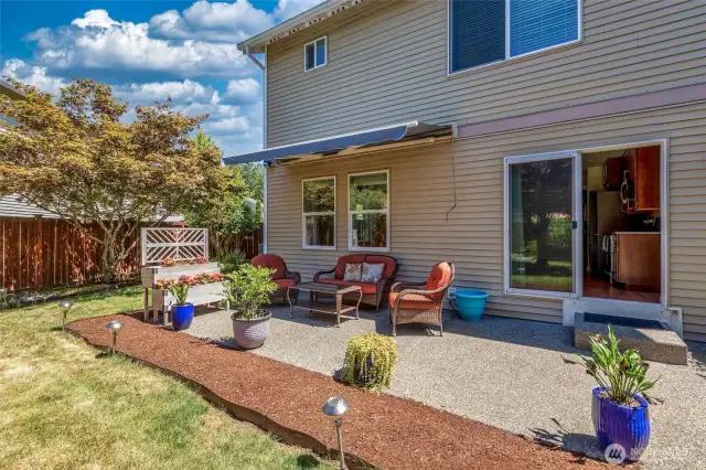 Expanded patio with ample room for seating and barbeque area. Kitchen access perfect for entertaining.
