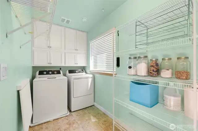 Roomy laundry pantry/laundry room just off kitchen.