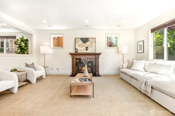 Open concept family room with adjoining kitchen