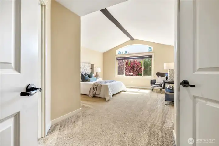 Double doors lead to your primary retreat with cathedral ceiling