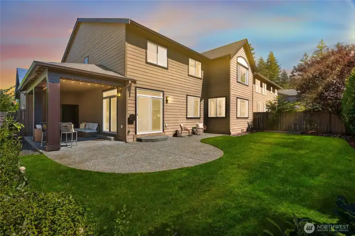 Level, easy maintenance, fully fenced backyard retreat.