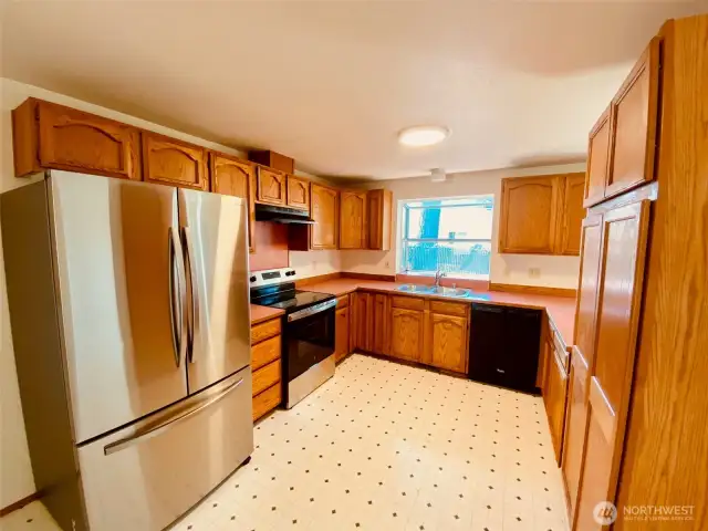 The kitchen features all stainless steel appliances  and a new stove. All appliances stay with home.