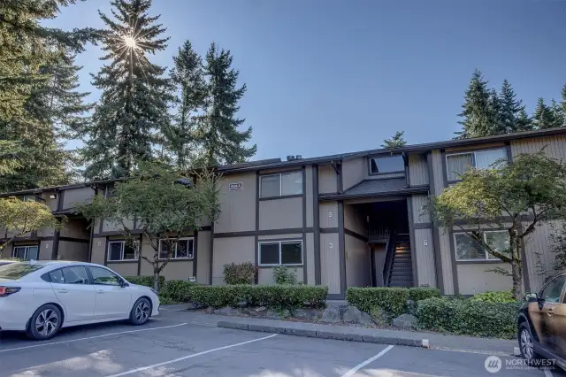 Designated parking space is in front of unit.  Plenty of guest parking nearby.