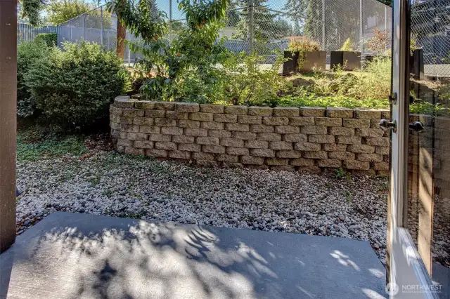 Unique feature of this unit is the raised garden area where a peach tree and blueberry bushes have been planted.  Water source is steps away.  Unit storage closet is on the left.