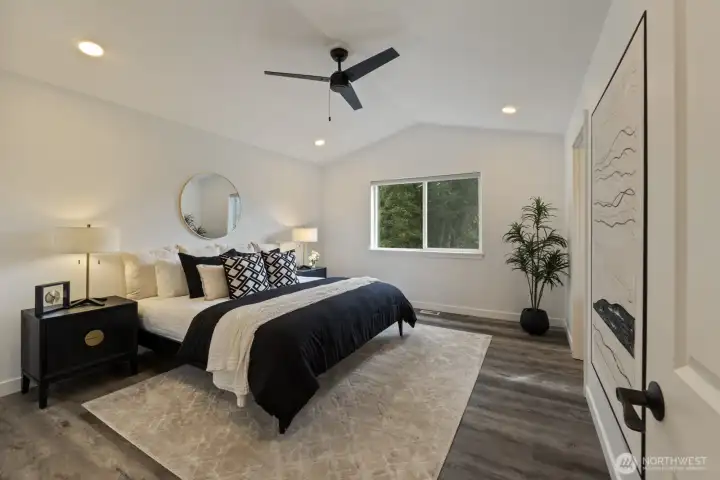 The very spacious Primary suite has vaulted ceilings and a modern & efficient ceiling fan.