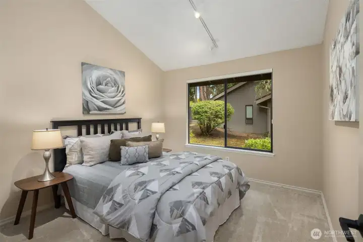 The second bedroom, along with all 3 bedrooms, has new carpet plus a large window and vaulted ceilings.