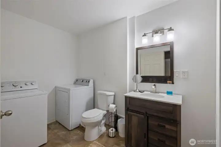 This level also includes a full bathroom with a washer and dryer, adding everyday convenience and independence. Whether you use the space as a guest suite or a secondary living area, it’s designed to stand on its own.