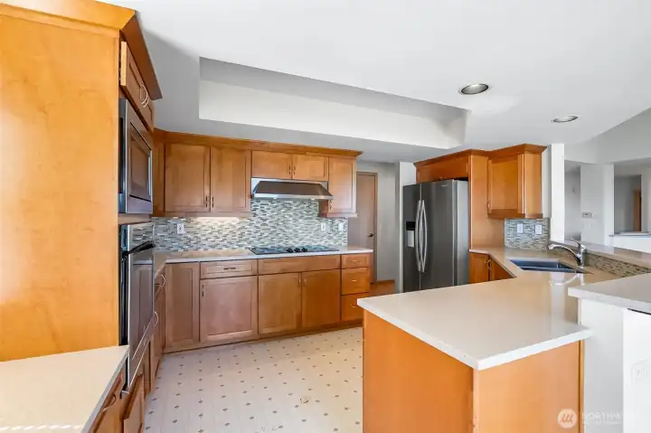 Kitchen with double ovens. All appliances stay