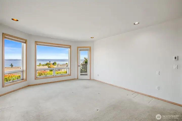 Primary bedroom with a view. King size bed easily fits with room to spare.