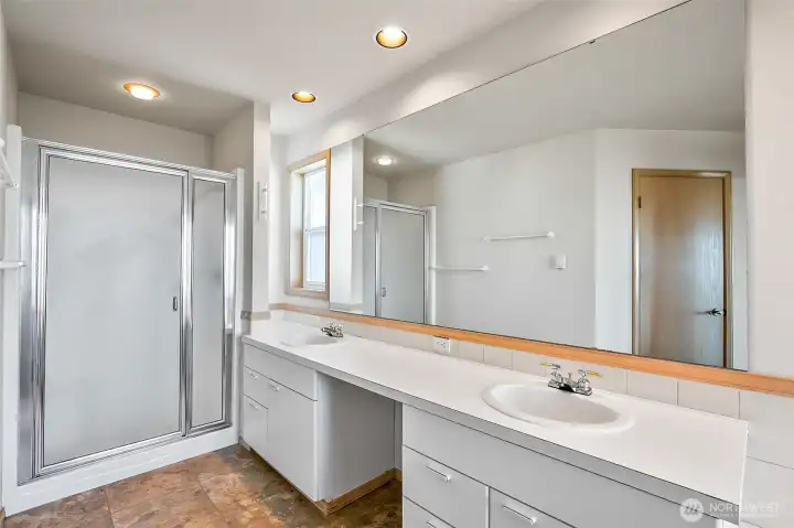 Primary bathroom with double vanity shower and huge soaker tub
