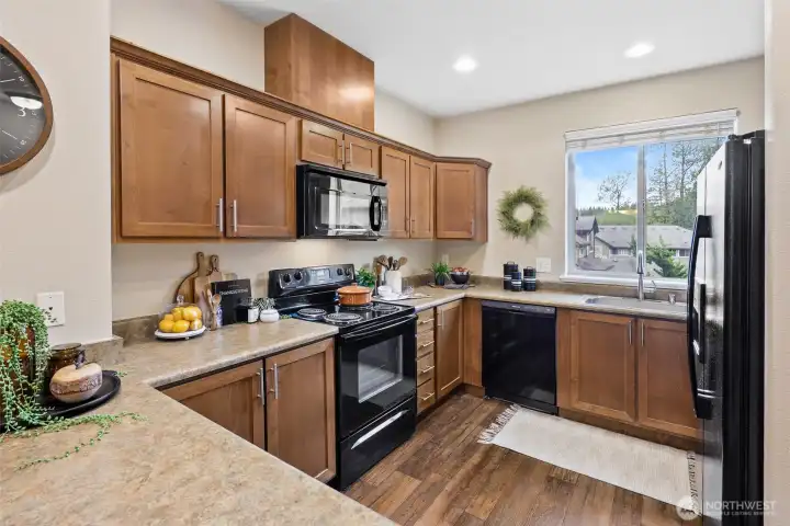 Kitchen has plenty of counter space, perfect for prepping dinners and hosting.