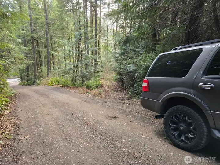 Good place to park and walk down roughed in driveway along south property line