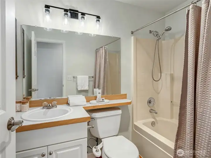 Mirror digitally added for marketing purposes; installed mirror is similar in style and slightly smaller.