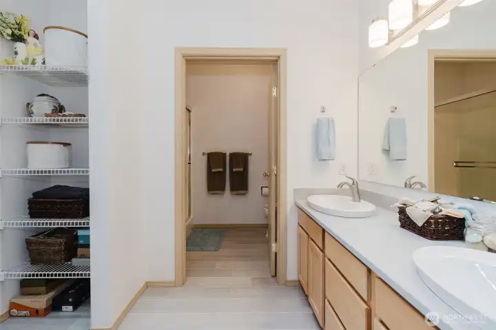 Updated, spacious bathroom with dual vanity.