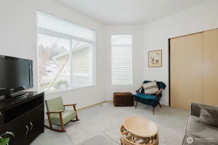 2nd bedroom with large picture windows overlooking front garden.