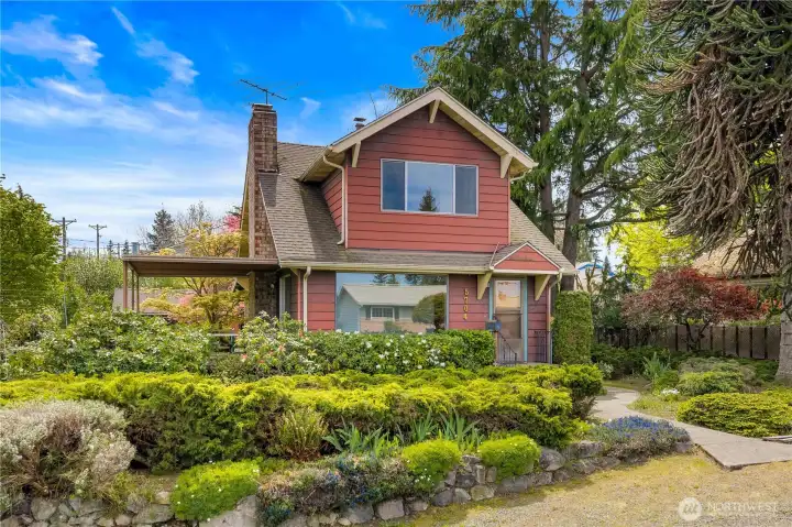 Charming 1927 North Tacoma home on a coveted corner lot, showcasing timeless character and inviting curb appeal just minutes from Point Ruston and the shores of Puget Sound.