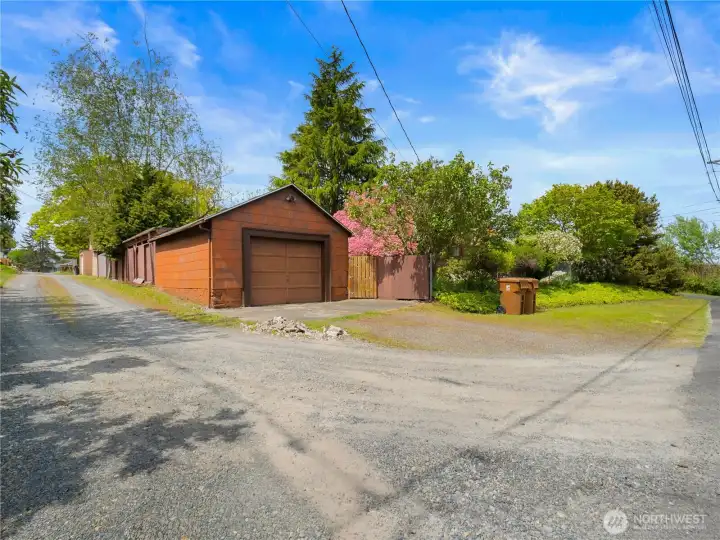 Detached one-car garage offers convenient parking and additional storage space, complementing the home’s functionality and charm.