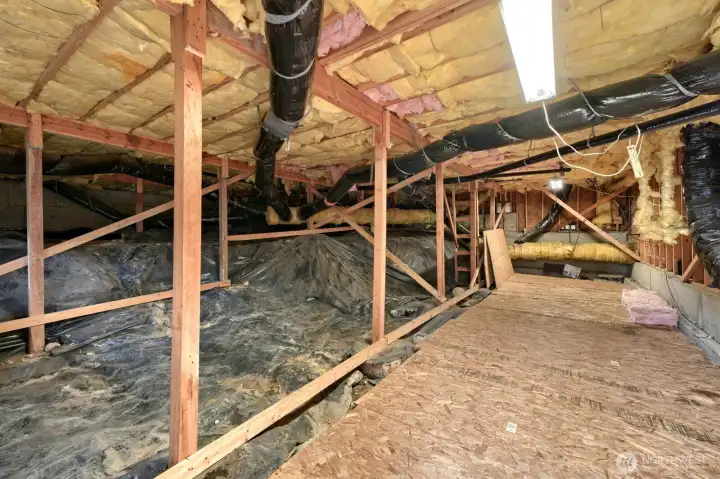 Accessed from outside there is a huge storage area under the home with electricity