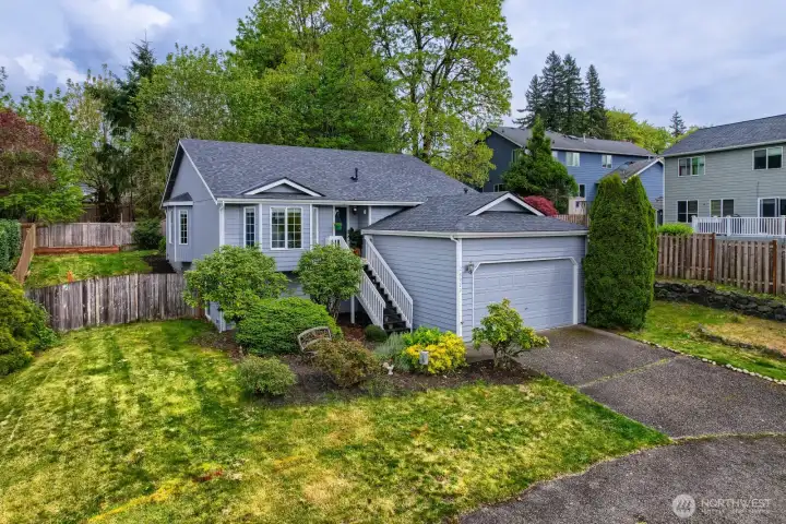 In addition to the 2 car garage, there's paved, off-street parking for 7+/- or, a boat or RV. Nice neighborhood with sidewalks on both sides of the street- good sized front yard set off the street filled with a variety of bushes, shrubs and seasonal flowers. In addition to the 2 car garage, there's paved, off-street parking for 7+/- or, a boat or RV. Nice neighborhood with sidewalks on both sides of the street- good sized front yard set off the street filled with a variety of bushes, shrubs and seasonal flowers.