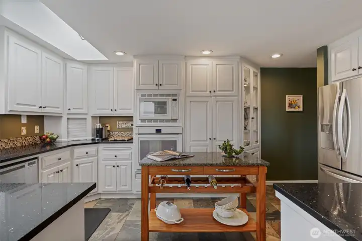 Updated kitchen with quartz countertops. Convection microwave oven