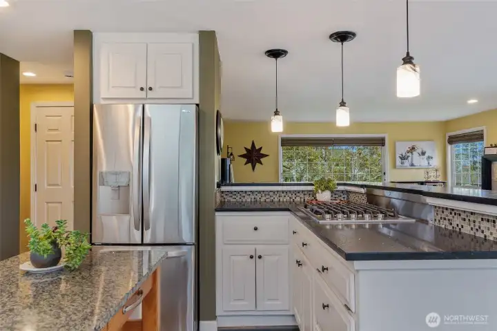 Upgraded stainless steel appliances, French door refrigerator with bottom freezer. Cooktop.