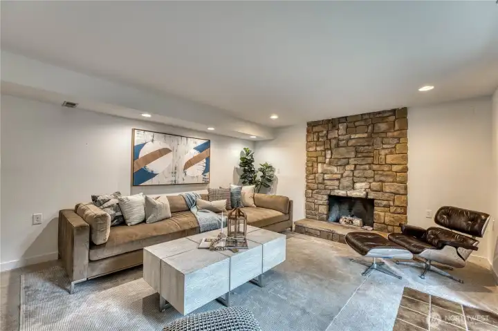 Cozy woodburning fireplace in the lower family room