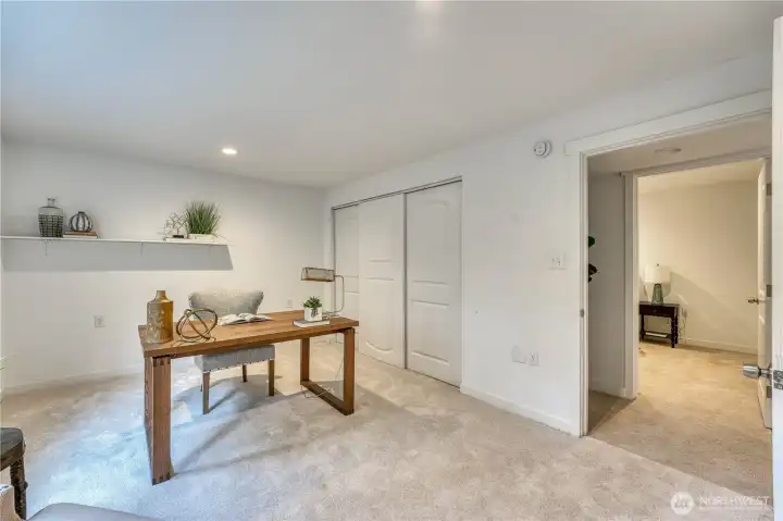 Lower bedroom with on-suite bathroom ( staged as an office )