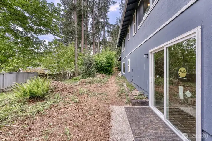 Back patio opens to a large private back yard setting.