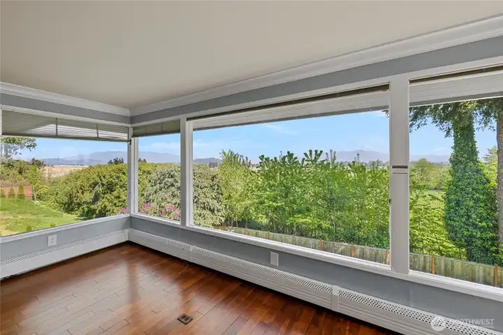 Wall of windows to showcase the view. Baseboard heating is a hot water boiler system.