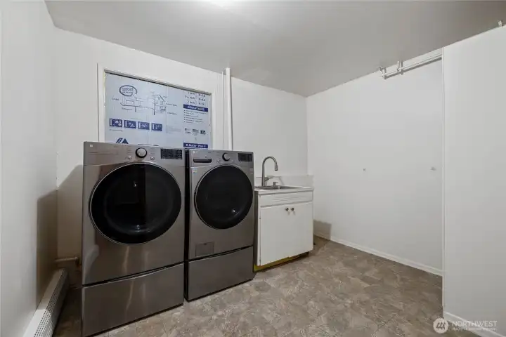 Lower level laundry room. Plumbed to be a half bathroom.