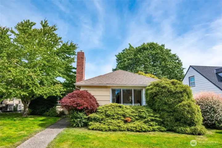 Home features lush planting in the front yard for lovely street appeal
