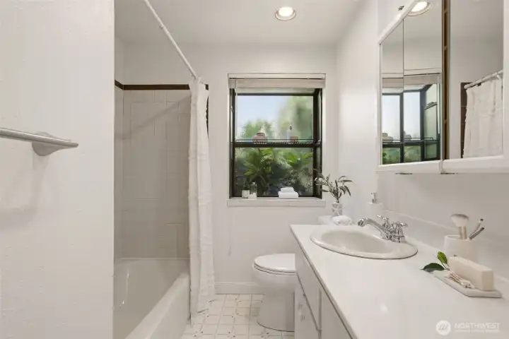 Hallway bath is close to all bedrooms