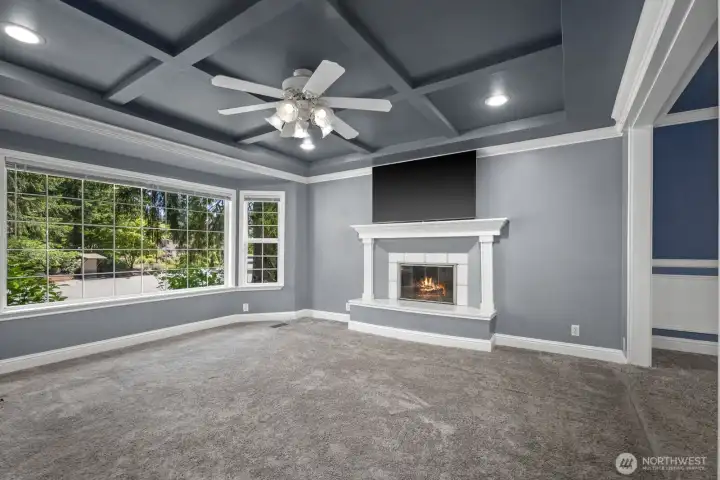 main level living room fireplace and windows
