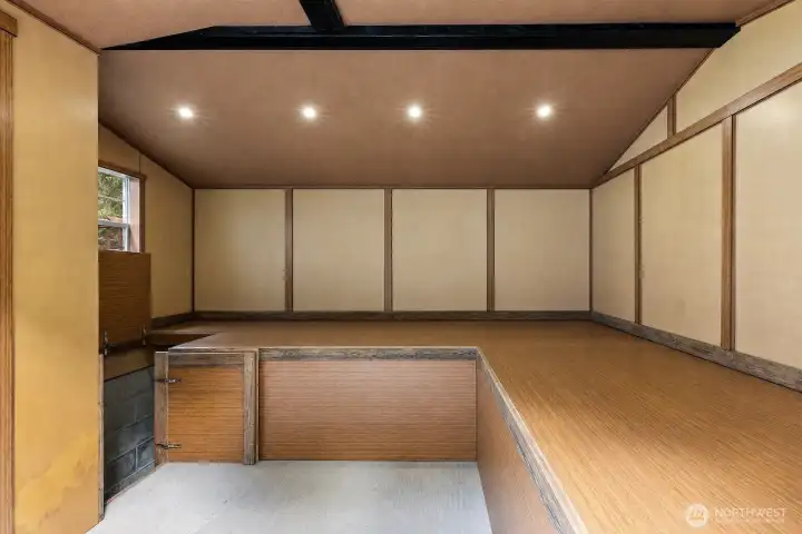 interior of shed showing opening to below ground storage