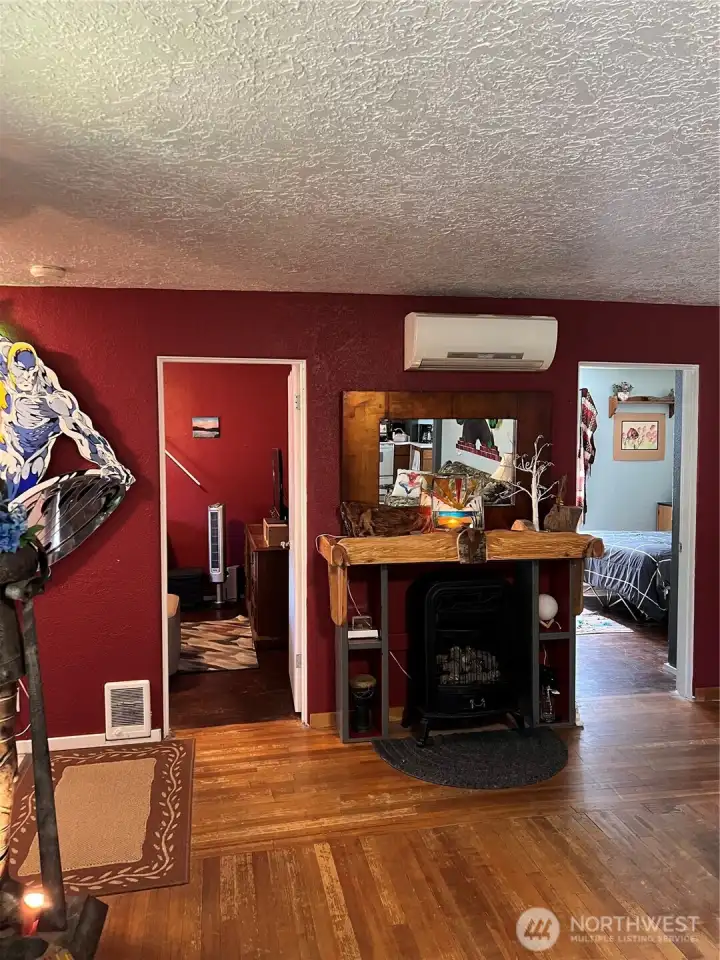 Propane fireplace is front and center. Door to left is bedroom #1. Door to right is bedroom #2 Propane fireplace is front and center. Door to left is bedroom #1. Door to right is bedroom #2