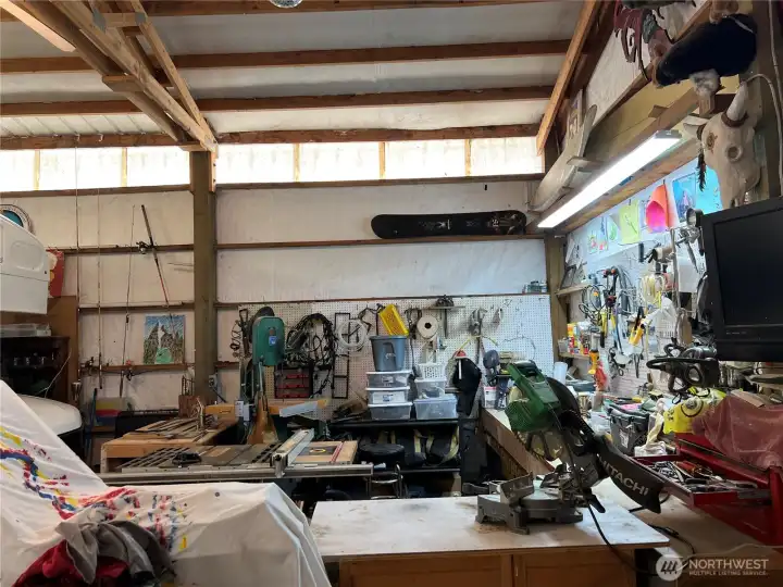 Garage has plenty of space for storage and workspace Garage has plenty of space for storage and workspace