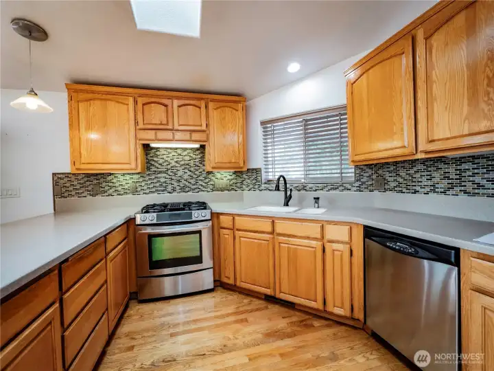 CORIAN COUNTERS AND TILE BACKSPLASH