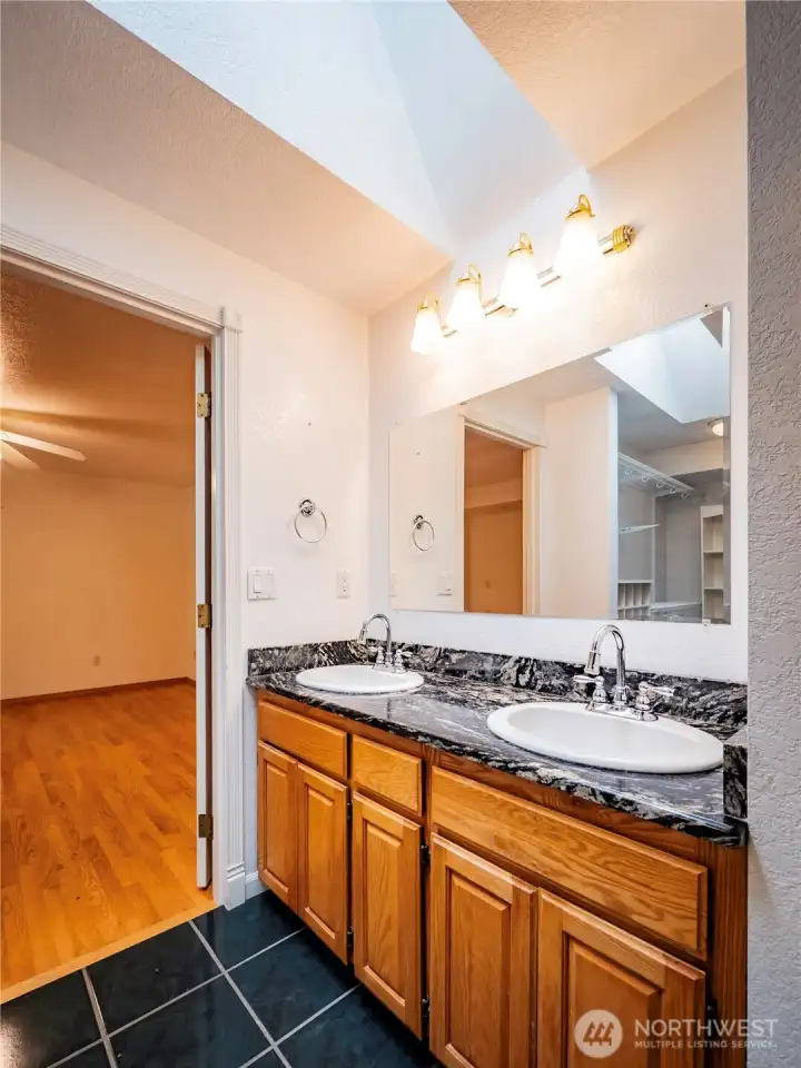 TILE FLOORING AND GRANITE COUNTER WITH DUAL SINKS