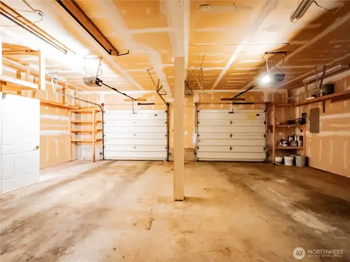 MONSTER GARAGE....SHOP AREA BEHIND ON RIGHT...NEW 90% EFFICIENCY FURNACE TO THE LEFT BEHIND