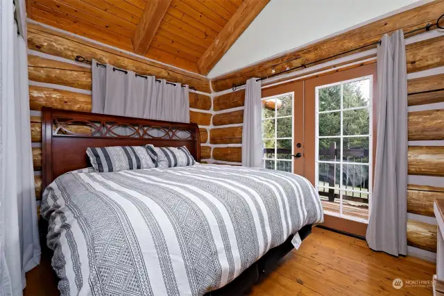 2nd guest bedroom with french doors leading to the upper deck.